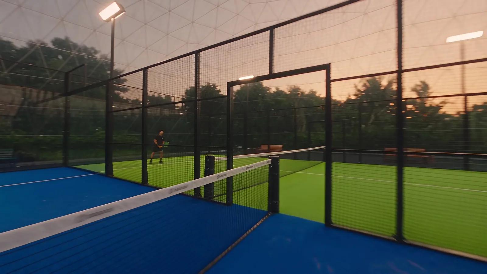 The blue and neon green courts inside the dome