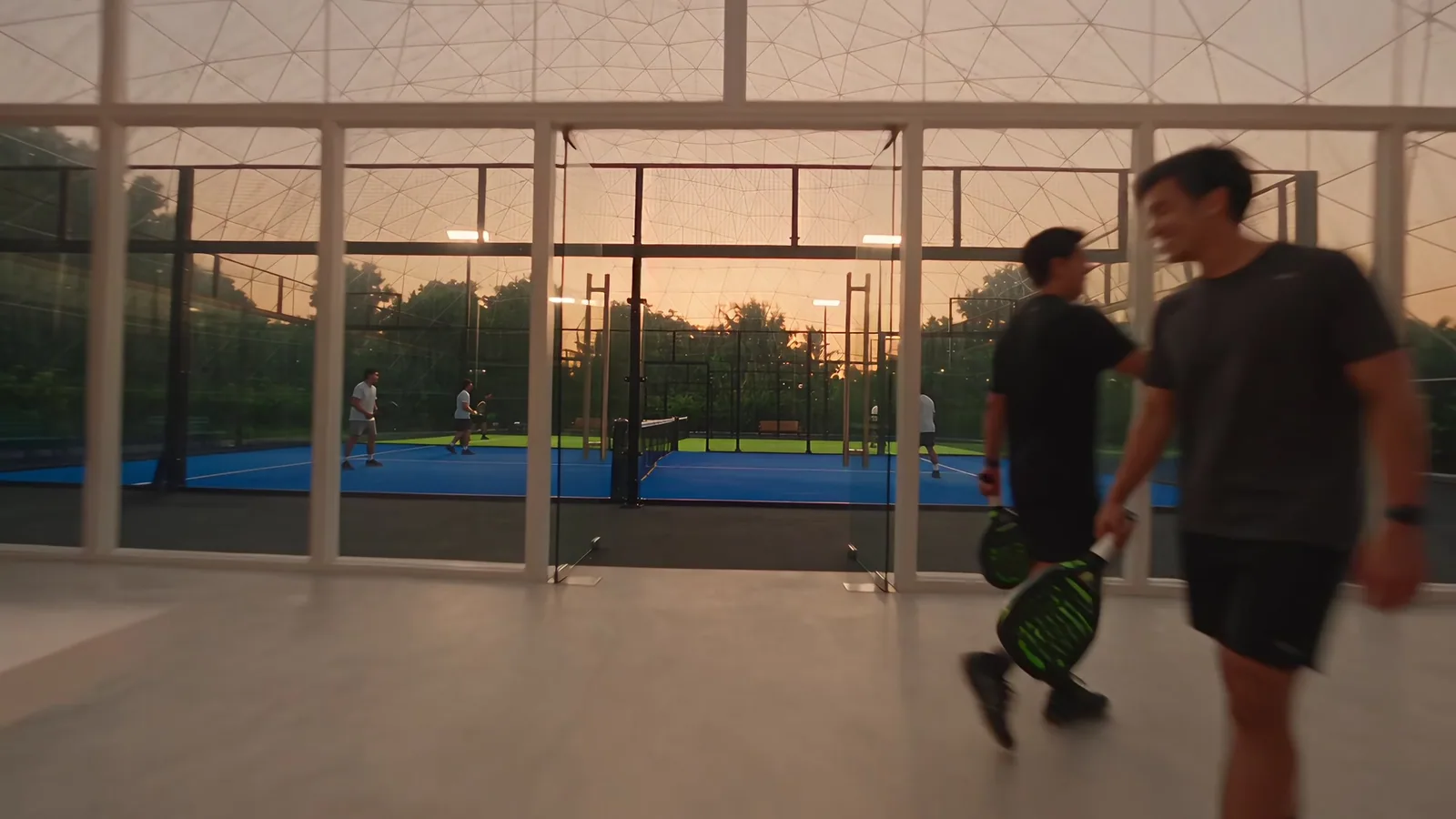 Two players walking in with their rackets